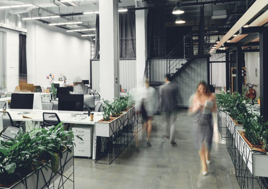 modern open space office interior with blurred business colleagues
